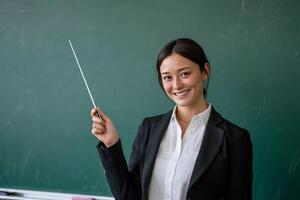 Teacher pointing with pointer photo