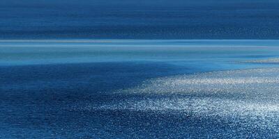 Water surface with subtle light variations photo
