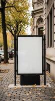 Blank Advertising Billboard on City Sidewalk with Autumnal Foliage and Architecture photo
