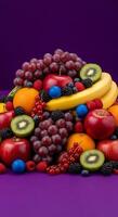 A pile of fruit on a purple background photo