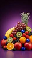 Vibrant Fruit Medley with Pineapple, Grapes, and Berries on Purple Backdrop photo