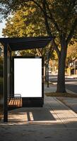 Blank Billboard at Bus Stop with Autumnal Trees and Street Scene photo