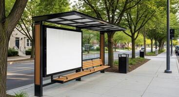 Modern Bus Stop with Blank Advertising Space, Trees, and Sidewalk in Daytime photo