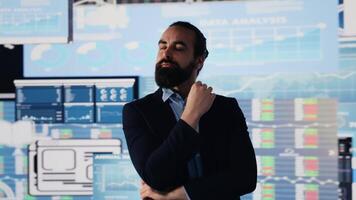 Conceptual image of a businessman in digital environment focused on metrics, strategic planning and profitability through technology. Insightfulness and forecasting activity. Camera A. video
