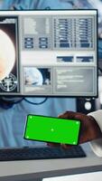 Vertical Astronaut reviewing onboard analytics on laptop before stepping out for scheduled operations outside space station. Cosmonaut verifying mission parameters after landing on alien planet, camera B video