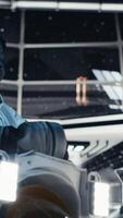 Vertical Astronaut blinded by light coming from alien vessel outside cockpit window while mapping unknown worlds. Cosmonaut studying cosmic origins making contact with extraterrestrial presence, camera B video