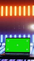 Vertical Empty space with colorful neon lights and an isolated laptop display creates futuristic cyberpunk vibe and artistic visual design. Modern urban style with glowing colors. Camera B. video