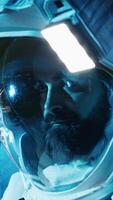 Vertical Astronaut returning from planet surface taking helmet off, talking with colleague using laptop to verify parameters. Cosmonaut finishing expedition chatting with coworker updating flight log, camera B video