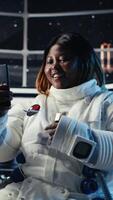 Vertical Man doing planet colonization reacts to extraterrestrial presence hovering near space station. Starship glowing as cosmonaut watches alien vessel approach while gathering stellar data, camera B video