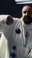 Vertical Cosmonaut in a space suit exploring the world above Earth, symbolizing the journey of humanity into cosmos. Endless pursuit of discovery, technology in the unknown universe. Camera A. video