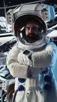 Vertical Upbeat astronaut greeting researchers during videocall presenting research data gathered during flight. Friendly woman in space station provides experiments observations to Earth team, camera A video