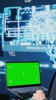Vertical Professional man ensures artificial intelligence algorithms with mockup screen, working with AI brain system for deep learning. Looks at neural networks data processing. Camera B. video