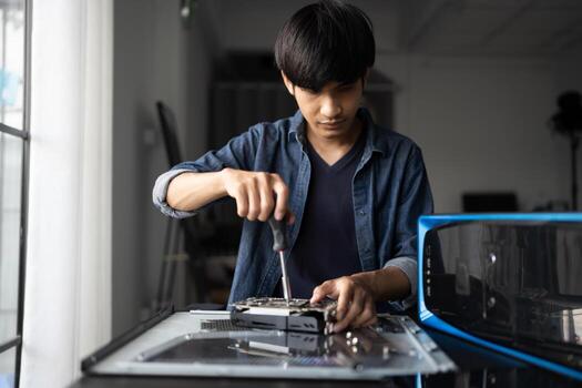 IT Engineer man is working on a computer photo