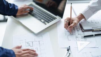 Architecture drawing on project business architecture building construction Colleagues designer Planning Design on blueprint and compasses photo