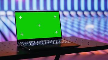 Empty space with colorful neon lights and an isolated laptop display creates futuristic cyberpunk vibe and artistic visual design. Modern urban style with glowing colors. Camera A. video