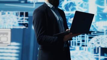 Young entrepreneur reviewing predictive analytics and machine learning algorithms. The digital interface reflects innovation, coding, AI ethics and platforms transformation. Camera A. video