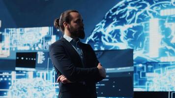 Male entrepreneur works on implementing AI brain system for deep learning, employing neural networks and cybernetics for growth. Using smart technology and algorithmic thinking. Camera A. video