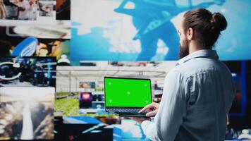 Casual young guy connecting on social platforms with mockup on pc, enjoying his online activity and interaction via social media. Engaging with people for entertainment. Camera B. video