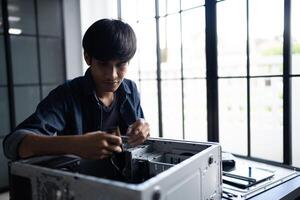 IT Engineer installing Hardware working on a computer photo