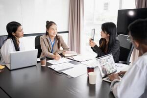 Business People brainstorming Meeting Design Ideas use post it notes to share idea professional investor start up brainstorming planning in office photo