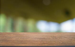 Empty wood table top and blur of restaurant background focus product display. photo