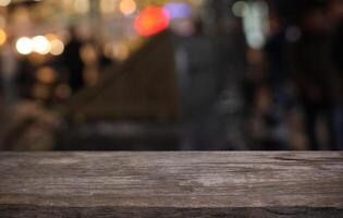 a wooden table top with blurred background photo