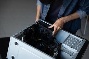 IT Engineer installing Hardware opening a computer case photo