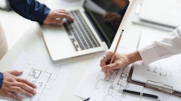 Architecture drawing on architectural project business architecture building construction Colleagues designer Planning Design compasses. photo