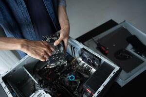 a person is fixing a computer in a case photo