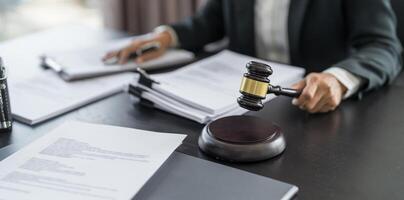 lawyer and judge at the desk with papers and gavel photo