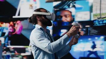 High tech person uses virtual reality headset for a 3d web design, showcasing artificial intelligence for social media connection. Influencer working on storytelling for digital world. Camera A. video