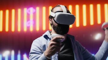 Artsy young guy immersed in virtual reality under neon lights and cyberpunk glow, blending street style with modern fashion and technology in a cool setting full of aesthetic visuals. Camera A. video