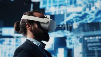 High tech expert uses vr glasses next to neural networks AI brain system, using predictive analytics and cybernetics for machine learning. Cloud computing automation tools. Camera A. video