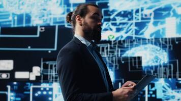 Entrepreneur uses laptop to review artificial intelligence brain system on dashboard, using high tech data visualization for coding, analytics and deep learning. Strategic growth. Camera A. video