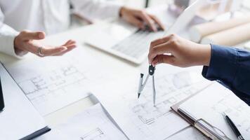 Architecture drawing on architectural project business architecture building construction Colleagues designer Planning Design on blueprint and compasses. photo