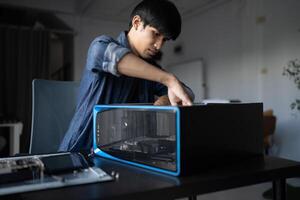 a man is working on a computer in a room photo