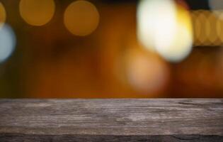 wooden table top with blurred bokeh lights. photo