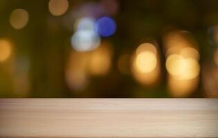 empty wooden table top over blurred bokeh background photo
