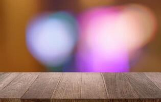 Empty wood table top and blur restaurant background, selective focus product display. photo