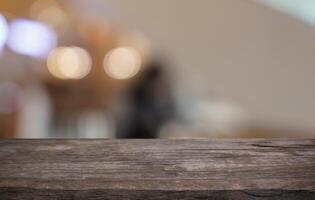 Empty wood table top and blur of restaurant background, selective focus product display. photo