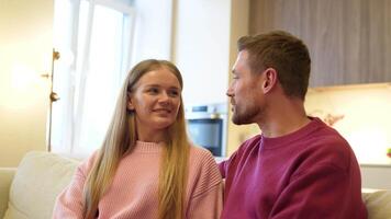 Joyful woman admires husband opening up, embracing look at each other, intimacy, romantic trust video