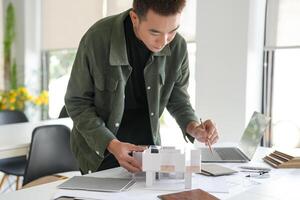 a engineer is working on a project with a laptop photo