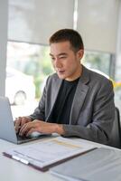 Businessman working using laptop computer Hands typing keyboard. Professional investor working start up project. business planning in office. Technology business photo