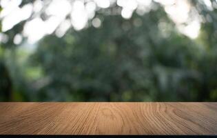 empty wooden table on blurred background. photo
