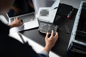 a person is working on a computer with a motherboard photo