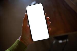 Smart phone mockup. Women hands holding smarphone blank copy space screen smartphone blank white screen isolated technology photo