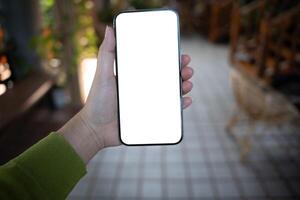 Smart phone mockup, Women hands holding cell phone blank copy space screen smartphone blank white screen isolated technology concept. photo