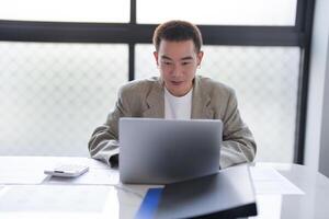 Business man working using laptop computer Hands typing keyboard. Professional investor working start up project. business planning in office. Technology business. photo