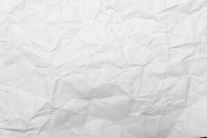 Crumpled white paper abstract shape background with space paper recycle for text. photo