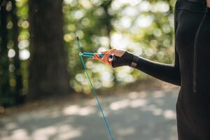 Close ,,up ,,view of, woman with jump rope outdoors photo
